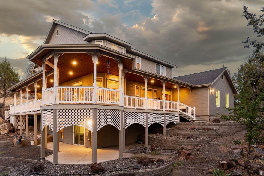 Amazing home in Sunset Hills w/ dual living opportunity plus large shop on .75 acres. Stunning Mountain & Valley Views from upper level. Lg wrap around deck w/ rocky backdrop & water feature for relaxing on open decks. Tiled entry opens to main level w/ Family Rm, Vaulted L/Rm w/Gas FP, built in entertainment center & cathedral windows, Formal D/R, Kitchen, Nook w/ access to deck, Master Suite features tray ceiling, walk in closet, marble shower & jacuzzi tub/shower & dbl sinks. Living quarters on lower level include Lg Living Rm, Kitchen, Dining area, bath w/arched marble shower & tile floors. Huge storage room plus Bedroom w/ built in storage & murphy bed, all w/ private access to outdoor patio. Top it off w/ Lg Shop, 2 doors, 220 power & bonus room above! Natural Landscaping w/ drip system.