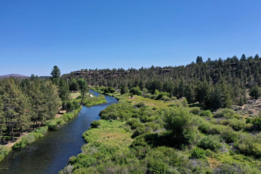 In a class by itself! Don't miss this rare opportunity to own 80+/- acres of land along the Deschutes River in unincorporated Tumalo, Oregon. This one-of-a-kind property is currently made up of a 42+/- acre parcel zoned TUR5 with development potential, a 38+/- acre parcel that includes approximately 3,000 feet of Deschutes River frontage on the lower elevation with gorgeous Cascade Mountain Views from the MUA10 zoned acreage above the rim. Seller has an engineered drawing for a potential development plan on the parcel zoned TUR5. Additional maps and pertinent land use documents are available. Buyer(s) to do their own due diligence with Deschutes County.