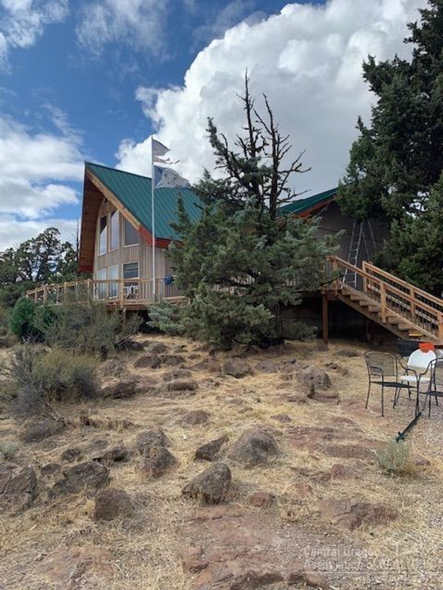 Come enjoy the gorgeous mountain views and acreage in Whispering Pines. This cute chalet is perched on top of the hill with terrific views from the wrap-around deck. Big windows in the living room, and wood burning stove. Come live the country life!