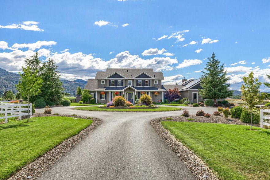 One of a kind opportunity in west Central Point: 20 irrigated flat acres in the Urban Reserve w/a beautiful 6168 sq ft custom builder's own home completed in 2014. Estate setting, 600 ft  long paved and circular driveway with water feature, 2400 ft of white vinyl rail fencing. 3600 Sq Ft 1930's barn restored w/perimeter foundation and new wall boards, attached chicken coop and cross fenced orchard area. 5280 sq ft insulated shop + 720 sq ft storage loft, 1/2 bath, commercial sink, 20' tall with a 20' x 14' roll up door, RV parking/hookups. 1479 square foot covered rear patio with hot tub, seating area, dining, outdoor kitchen with walnut cabinets/granite counters/fridge/burner/bbq/TV/sink and bar seating for 10 overlooking park like backyard & 20 x 40 inground pool w/slide. Pool building with garden room, 1/2 bath, pool equipment, wood storage, and accessible  ''recreation'' room w/kitchenette, ductless heat/air, full bath, walk-in closet. Seller is a licensed agent in the state of OR