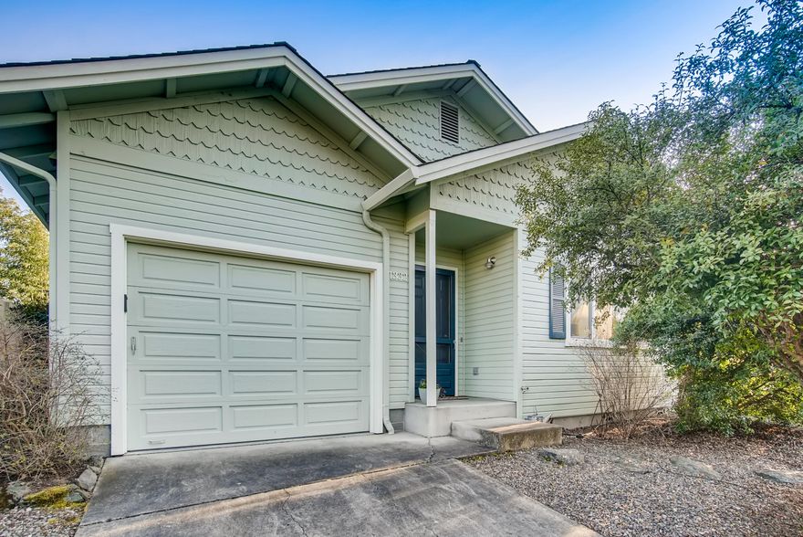 Light, bright and updated, this Mill Pond home brings you the best of Ashland. It's quiet and comfortable, yet located near the Railroad District, farmers market, Garfield Park and downtown shopping. You'll live the easy life in this lovingly maintained single-level home, with professionally designed easy care landscaping, oak hardwood and tile flooring throughout, and updated kitchen and bath. Open living area features a vaulted ceiling, with well laid-out kitchen, dining and living spaces. The primary bedroom has a walk-in closet and a sliding door to the fenced back yard. A retractable awning creates shade and privacy. Convert the 500 sq' attic to storage or living space!  Built to Super Good Cents standards, the home has an air exchanger and newer mini-split for comfort and cost-savings. Single-car garage. Completely move-in ready, all appliances included. Recent updates include: roof in 2015, water heater in 2020, interior and exterior paint in 2014.