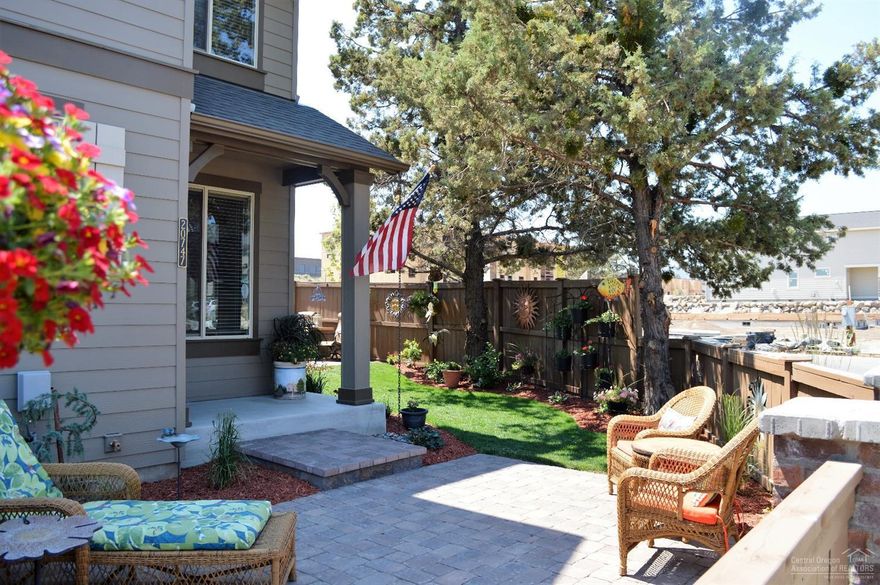 Stylish Townhome situated nicely in the desirable McCall Landing neighborhood on a corner lot with large beautifully landscaped and fenced side yard complete with stained concrete patio with paver extension. Relax in this comfortable outdoor living space and enjoy this beautiful home in a terrific Northeast Bend location. This home features a spacious Master suite and nice loft area suitable for many uses. It is rare to find a townhome in such excellent condition with this lot size. Act now.