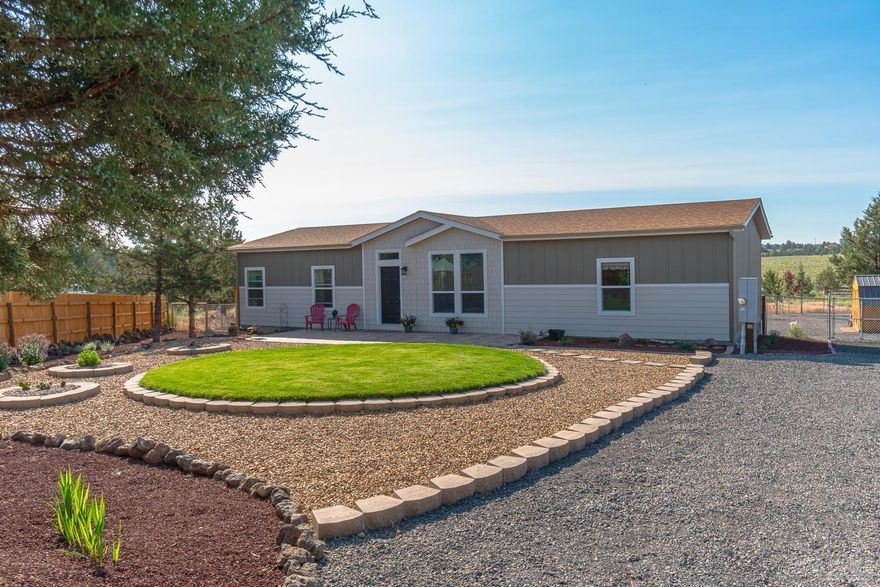 Enjoy the sunrise over the meadow in Crooked River Ranch! Better than new home built in 2018 & finishing touches in place. 3 bedroom, 2 bath home w/Great Room layout & a fantastic kitchen. Massive windows & 9' ceilings throughout, this home lives large! Kitchen has an expansive central island that makes entertaining a breeze. Stainless Steel refrigerator, range, micro hood & dishwasher, durable laminate counters & full height tile backsplash. Lg, walk in pantry & store room. Open living area w/Private Master Suite features a door less walk in shower, vanity & plenty of natural light. Guest rooms & full bath at opposite end of home. Stamped concrete entry & patio, large back deck & lush back lawn. Lot was leveled, manicured & landscaped w/full fencing & gate right out to the meadow community trails. RV parking, electrical & water hookups in place. Furnishings available!