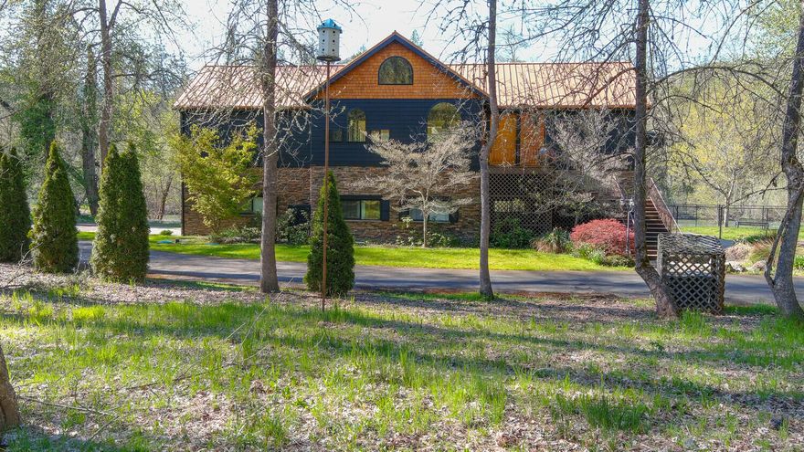 A beautiful Rogue Riverfront property, just minutes to town! This is a true Southern Oregon Retreat on 4.95 acres, gated, vinyl fencing, asphalt driveway, and amazing river views. The home has 17-ft ceilings, a beautiful open concept floorplan, hardwood floors, and floor to ceiling windows. The upper floor has 2304 sq ft, with 2 master bedrooms, both with full ensuite bathrooms. The kitchen has granite counters and newer stainless appliances. The dining room and great room open out to two fabulous decks. The ground floor has 2250 sq ft with two bedrooms and one full bathroom. Both floors have their own laundry, and the ground floor has a game room. There is 4 car garage parking, a convenient elevator between floors, and the ground floor rooms have their own private access, plus unobstructed views of the river. There is 675 ft of riverfront, a boat launch, and Gold Nugget Park is across from the property. It is a special private sanctuary where quiet relaxation and views of nature aboun