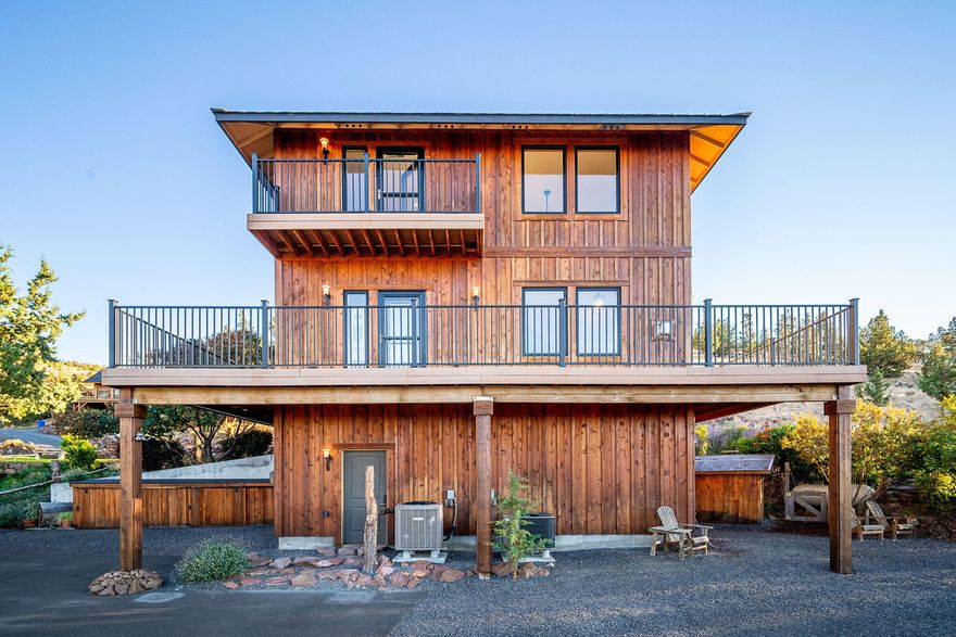 Discover a one-of-a-kind Central Oregon retreat where breathtaking Cascade views, unmatched privacy, & endless adventure meet—perfect as a vacation getaway, peaceful primary residence, or outdoor getaway.  Nestled on 5.04 private acres, this 1,910 sq. ft. custom-built home offers 3 bedrooms, 3 baths, & timeless craftsmanship. Expansive Mill Guard windows and a 360° wrap-around deck frame sunsets over Mt. Jefferson, Hood, Black Butte, Broken Top, and even St. Helens. Adjoining 2,381+ acres of National Grasslands with access to BLM land, the property is ideal for hunting, hiking, horseback riding.  Inside, enjoy hardwood floors, custom woodwork, stainless counters, propane range, and a versatile loft. Outside features include trimmed junipers, fertile soil, a dry sunny climate, and private paved access. Minutes to Haystack Reservoir, Lake Billy Chinook, Smith Rock, Culver, Redmond Airport, and just 45 minutes to Bend. A rare chance to own serenity, recreation, and views that never end.