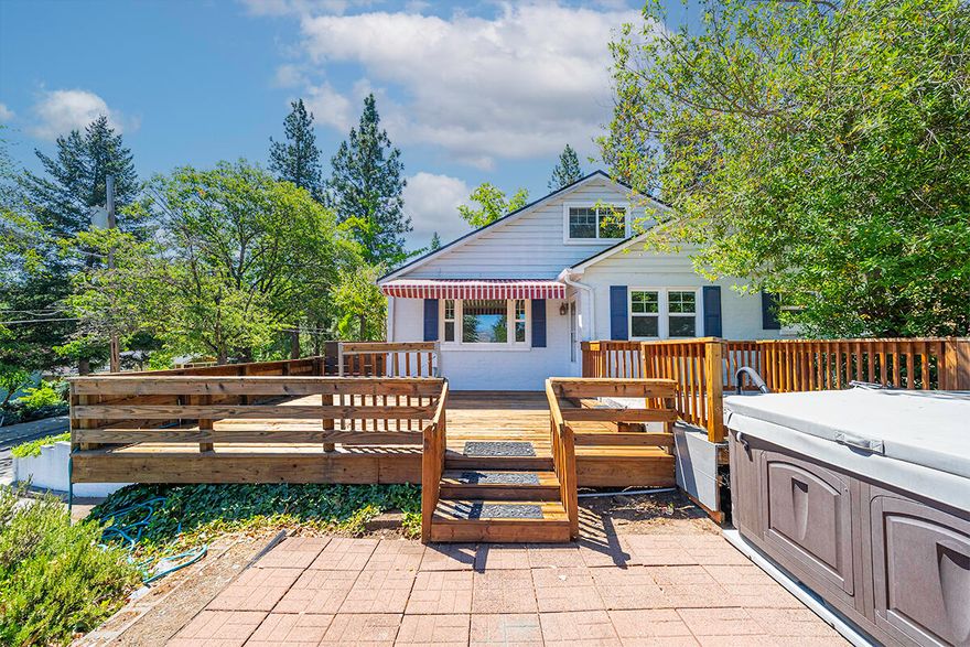 Beautiful mountain views from this hillside home.  This charming 1947 home offers classic character and comfort with entry vestibule, arched doorways, large picture windows, many built-ins and a living room fireplace. Spacious living room with bamboo floors, large picture windows framing the view and a lovely dining room with built-in buffet. The kitchen is spacious with abundance of counter space, crisp white cabinets and loads of built-ins. Featuring 3 bedrooms, 2 bathrooms, all on the main level and a versatile sizable loft on upper-level.  Enjoy outdoor living on the spacious relaxing deck—perfect for sunrises and taking in the view. This property is private and the lot is spacious. Sweet, small, detached studio is wonderful for private space to use as an office, for hobbies, to create or for storage. Also includes a one-car garage. Lots of parking. A wonderful opportunity to own a piece of the past with modern comfort.