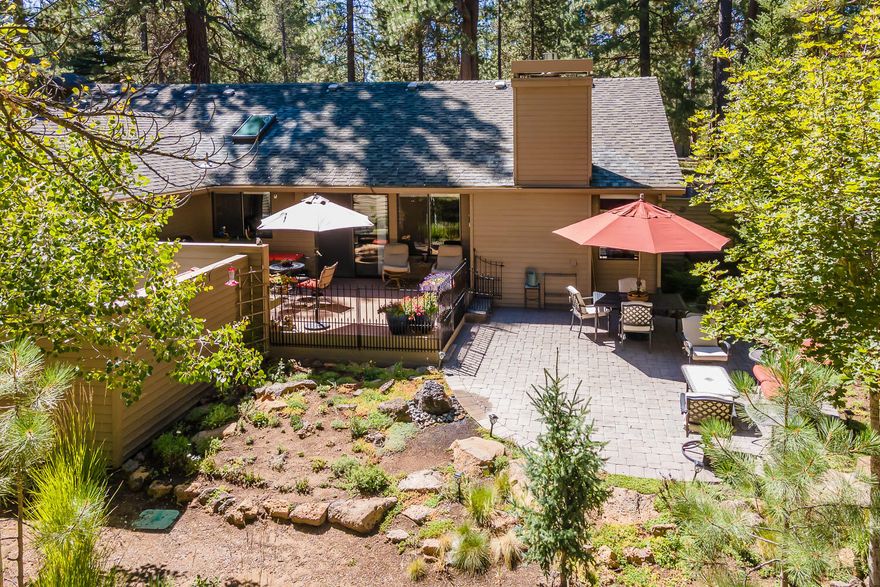 Your Sunriver oasis awaits - this impeccably cared for, single level home has 3 bedrooms PLUS a den, and is tucked away on a quiet and beautifully landscaped lot. Thoughtful updates including granite countertops, stainless appliances, and hardwood flooring, pair seamlessly with timeless features such as an open floor plan, vaulted tongue-and-groove cedar ceilings, and a gas fireplace. The spacious primary suite is situated at the end of hall, past the 2 comfortable guest rooms, boasting deck access and an en-suite bathroom with dual vanity. Enjoy the vaulted family room/den with it's own, private deck space & attached office nook - perfect for movie night - or step outdoors to lounge on the deck & paver patio, and star-gaze from the private hot tub. Find extra storage in the attic space above the attached 2 car garage. However you choose to ''Sunriver,'' this home offers something for everyone!