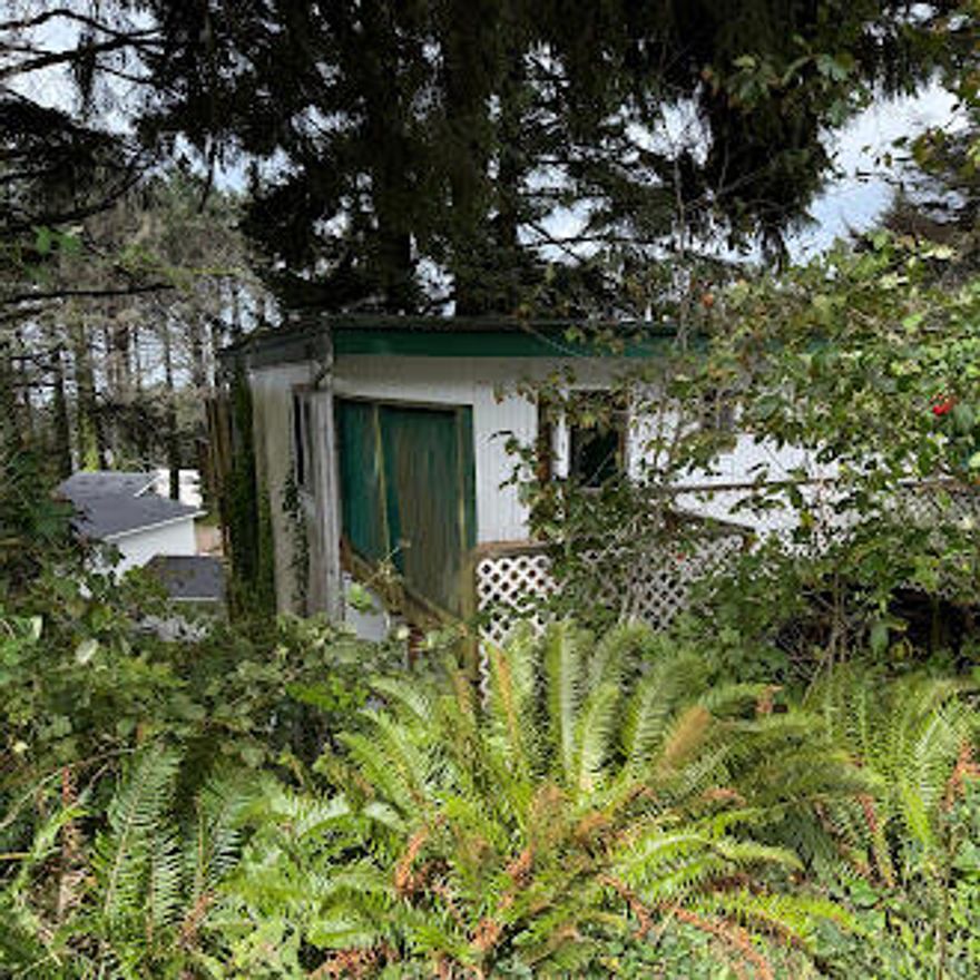 Beautiful lot in Lincoln City! Bring your vision and build your dream home with the potential for stunning ocean views from the top. Located less than a 15-minute walk to beach access, this property offers the perfect opportunity to enjoy all the beauty and charm that Lincoln City has to offer, including miles of sandy beaches, unique shops, restaurants, the outlet mall, Devil's Lake, and Chinook Winds Casino. Situated on a .09-acre lot, the existing 2-bedroom, 1-bathroom home (1,056 sq. ft.) is a true fixer, offering incredible potential for full renovation or a brand-new custom build. Whether you're an investor, builder, or homeowner ready to create your coastal retreat, the possibilities are wide open. This is a rare chance to reimagine a property in one of Lincoln City's most desirable areas. Sold as-is. Buyer to do due diligence.