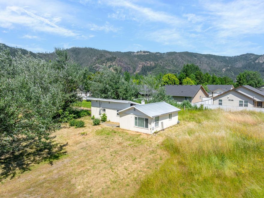 A great find in Tri City—this property includes a 1950-built 2-bedroom, 1-bathroom home on a 0.42-acre lot plus two additional parcels measuring 0.23 acres and 0.19 acres. With a combined total of 0.84 acres in town, the possibilities are endless. Renovate the existing home, build new, or develop the adjoining lots for growth, income, or simply the benefit of extra space.

Buyer to perform due diligence regarding development possibilities. An affordable opportunity in Douglas County, ideal for investors, builders, or anyone looking for a project with promise. Don't miss out!