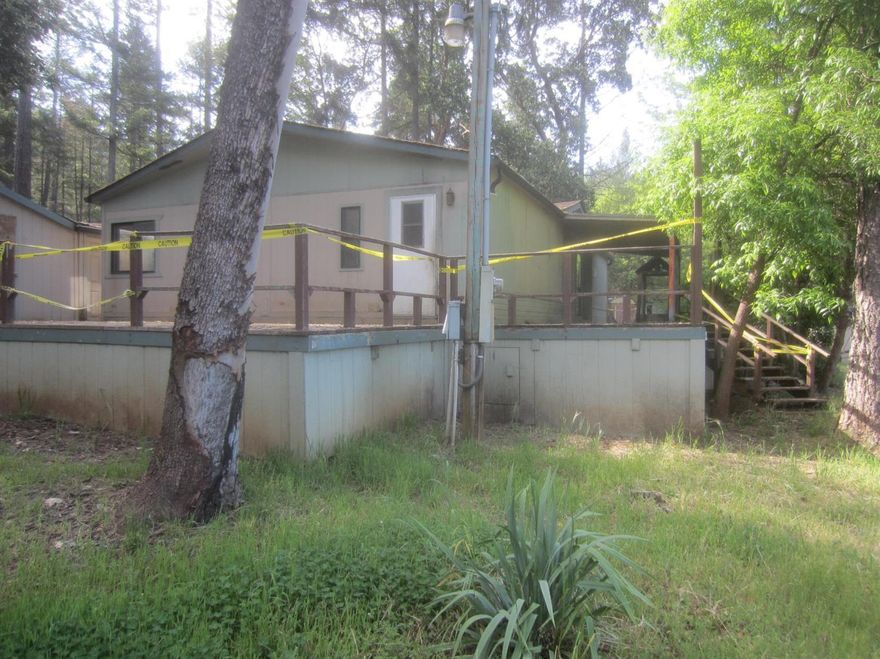 Nice property with over 5 acres of wooded land, a manufactured home and a non-permitted stick built home.