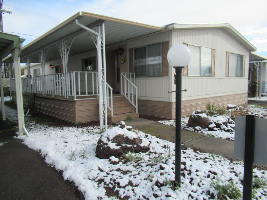 Located in a 55+ Community, a quiet and well-maintained park is this super clean 1978 3 Bedroom, 2 Bath manufactured home move-in ready. New roof in 2019. This home comes with all appliances, it has a nice private covered front patio, metal storage shed, and covered carport for easy back door access. Inside you will be welcomed into a nice size living area. The circular kitchen offers a open floor plan into the dining room and den. The den has a cozy gas fireplace with sliding glass doors that opens up to the covered patio. The Primary bedroom is large with an en suite bathroom. Large closets and  lots of storage space is available in this home. ALL OFFERS must be accompanied with a pre-qualification from Summers Lane Estates park manager Richard Pierce~541.205.8668. Monthly Space rent is $400.00 and includes; water, sewer, garbage and snow removal. One pet under 20lbs allowed. *See public documents for a pre-qualification application which has a $45.00 non-refundable processing fee.