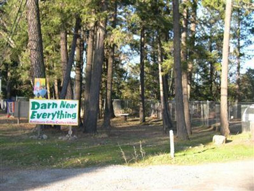 Highway 199 frontage. Distribution facilities, mini storage, community building, auto sales, equipment sales, museum, manufacturing, mini storage, fabricating...these are only a few of the uses allowed on property with RI zoning. This property has RI zoning. 1.83 acres with a 2400 sq. ft. building. Easy access off Redwood Hwy. Huge fenced area. Two roll up doors. Newer roof. Using city water now but property also has a well. Lots of trees at back of property.