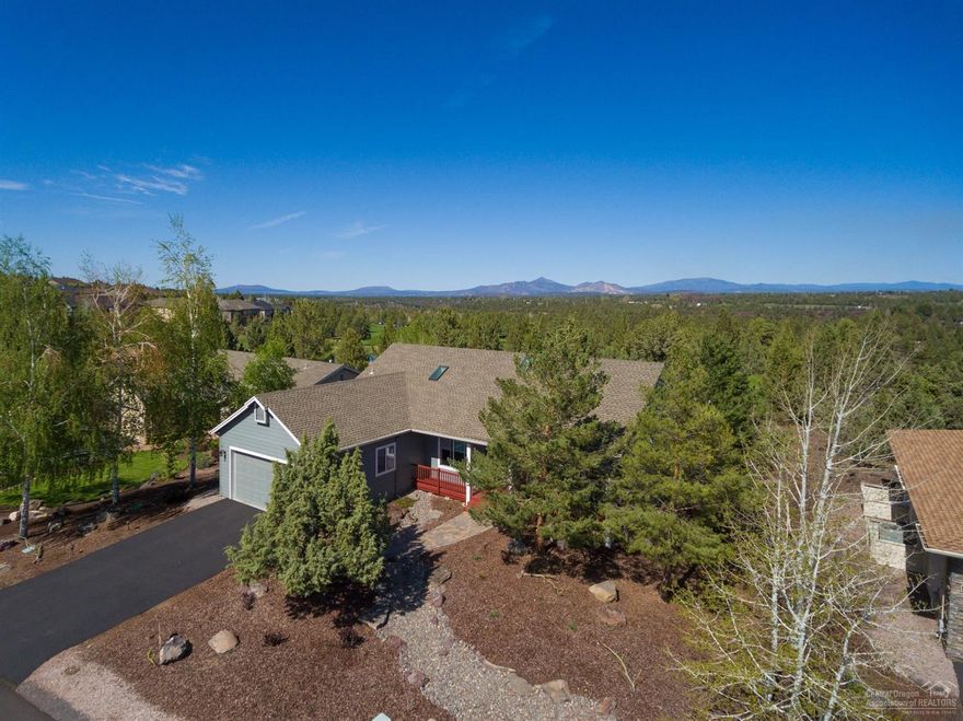 Nicer than new single level home in the premiere 55+ community, The Falls at Eagle Crest. It is nicely situated just behind the 14th tee of the Challenge Course at Eagle Crest. The kitchen was recently remodeled w/custom cabinetry, countertops, & stainless appliances. Both baths feature new cabinetry & full tile walk in showers w/tastefully chosen finishes. The living space has hardwood & tile flooring w/ Central Vac. The back yard is an oasis w/deck & built in planters/benches & an expansive pergola.