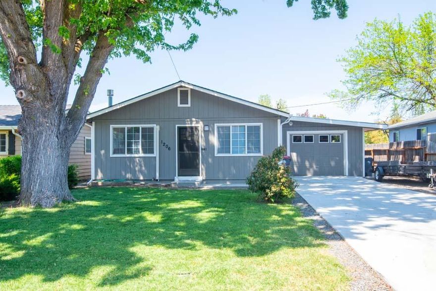 Super clean move in ready East Medford home under $250,000!  3 bedrooms, 1 bath.  Beautiful hardwood floors, free standing gas stove and new vent-less air conditioning system,  Roof is less than 10 years old and upgrades include double pane windows, electrical panel, doors and fixtures.  Garage has rear doors to nice size backyard.