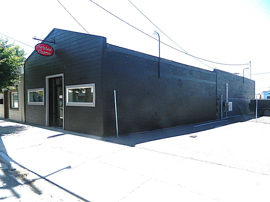 Come check out this well maintained commercial building. This building has a variety way of uses. It can be a small retail store with a warehouse storage in the back. It can be cleared out and used as a contractors secured building with a ramp in the back so you can pull vehicles in it. Could split it up with a few offices in it. There is a separate a parking lot with a security fence next to the building included in the sale.   Come bring your imagination and make this your own