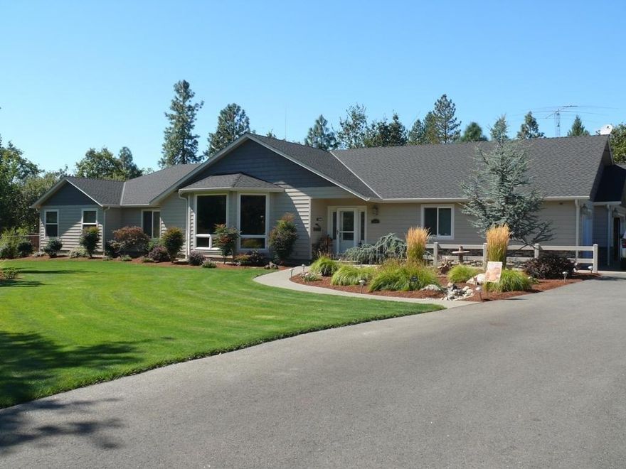 Stunning! This beautiful custom 2564 sf, one story home sets on 3.09 park-like acres in an area of fine homes. With quality craftsmanship and exceptional amenities, this home offers everything you've been searching for including large vaulted living room with bay windows, mountain views, fireplace, dining room, spacious kitchen and breakfast nook with skylight, granite counter tops, high-end appliances, pantry, and doors to an expansive 800 sf. deck. The 3 bedroom floor plan includes a wonderful master suite with private deck, 2 closets, and a spa-like bathroom. Cherry wood floors, maple cabinetry, laundry room, custom window coverings, back up generator, ceiling fans, and more. The 3 car attached garage is oversized and the 3rd bay with heat/air is ideal for hobbies or treasures! At the end of a cul-de-sac, gated and fenced, paved driveway, 28x42' RV garage/shop with 13' roll up door, additional 18x24' carport, garden shed, and beautiful landscaping.Call for your appointment today!