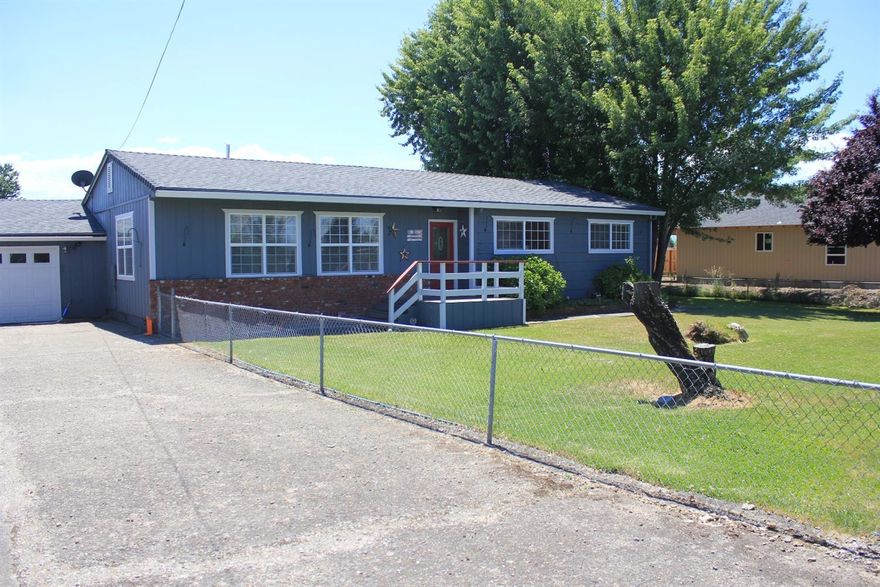 If you love to entertain & relax, this is the home for you! This 1,757 sq ft, remodeled home boasts gorgeous laminate flooring, updated electrical & plumbing, large bonus room w/ a gas fireplace & french doors leading to the large covered patio with a sauna, hot tub & a large fire pit area, perfect place to unwind! Home features a remodeled bathroom & kitchen w/ Staron countertops, Hickory cabinets & tile floors. 3 great size bedrooms, & extras which include the sauna, hot tub, appliances, TVs & more! Outside is a huge manicured yard w/ a unique adobe-styled fire pit area. Storage space w/ an approx. 12'x52' metal RV garage/workshop, 2 car garage & shed. THEN there is the parking! You could probably fit 10 cars in the garage & driveway alone, RV parking the full length of the 1/2 acre lot, not to mention the RV parking garage & area around it! Per seller, property may be sub-dividable for up to 4 lots, buyer to do own due diligence. Well maintained property! TOO many features to list!