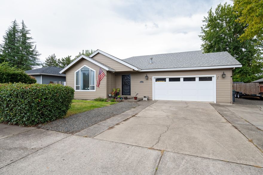 Well-maintained East Medford home with refreshed backyard, perfect for entertaining. This 3 bed, 2 bath home offers an open living room/kitchen floor plan with separate living & family rooms, vaulted ceilings, and nice entry. The spacious living room features large windows, while the kitchen boasts granite counters, plus a window overlooking the backyard. Family room with vaulted ceiling and dining area create a great gathering space. Primary suite includes a walk-in closet, ceiling fan, and updated bath with granite & tile. Hall bath also features granite and tile. Enjoy outdoor living with a private, fenced yard, sparkling pool, and deck. Additional highlights: indoor laundry with storage, finished 2-car garage with 220, wired for hot tub, shed with power and RV parking. Updates include interior and exterior paint, newer stainless appliances, and more!
