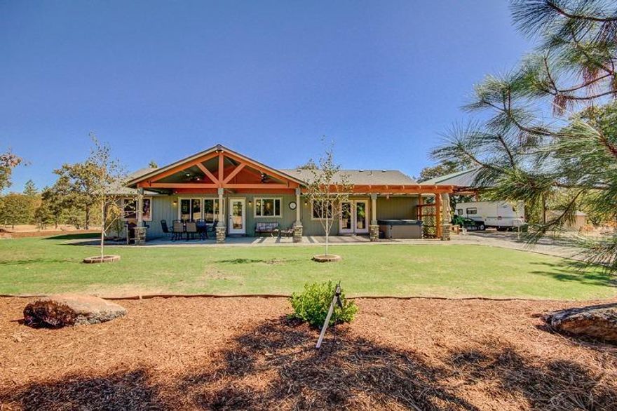 Drive through the Table Rocks and find this completely updated single level home nestled amongst the native oak trees with seasonal creek and pond. Enjoy the 15 private acres, security of a fenced in home site including a covered RV structure, storage sheds and vegetable garden! There is a separate shop building with its own well and electric service. Inside the open floor plan and vaulted ceilings leave plenty of room for entertaining. The new granite tops surrounded by custom cabinets and tile floors invite you into the freshly appointed kitchen with new stainless steel appliances. You may choose to dine under the covered terrace and enjoy the green lawn and new landscaping. The spacious master bedroom has plenty of room to relax with a spa tub right outside the door to bring you to rest at the end of the day. There are two wells and a storage tank that feed the main house.