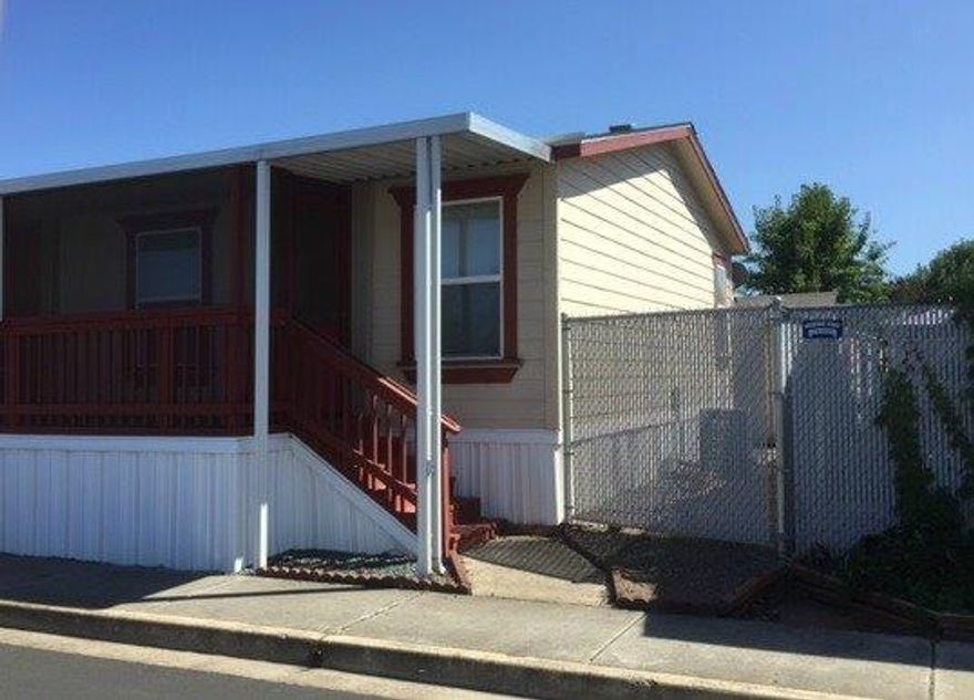 An amazing value for the first-time homebuyer, young family or retirees! This double-wide manufactured home boasts 1782 sf of living space and was built 2004. Three bedrooms and two full bathrooms with large family and living room. 60-foot-long screened-in deck perfect for relaxing with a cup of coffee. One covered parking space. Home is on large corner lot in Meadow View Estates all-family park. Space rent is $540/month
