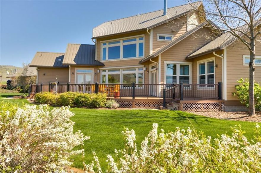 Elegant estate home on 9.72 irrigated acres with extraordinary Ashland views just 7 minutes to the Plaza. This 3,700+ sqft classic by Ray Kistler & Sean Downey is wonderful for entertaining with a comfortable open plan, excellent natural light, gourmet granite & cherry kitchen, custom appliances, rustic cherry-plank flooring, beautiful trim, formal and informal dining, butler's pantry, spacious two-story living room with wall of windows, fieldstone fireplace and cozy TV room, too. 3 bedrooms, 3.5 baths, main-level master with dual walk-ins, sitting area, tile & limestone bath, dual basins, tub and jetted shower. Includes a large family room, two guest bedrooms with en-suite tile baths, dual heat systems, 1400 sqft garage/shop with three bays and expansive storage, standing-seam metal roofing, Hardi-plank siding, Timber-tech decking, paved drive, RV parking and extensive guest parking. Beautiful landscaping, raised garden beds, small orchard, pastures and 360 degree views! Truly Amazing