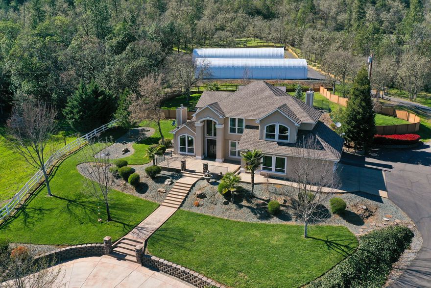 Huge Price Reduction! Well below seller's investment/replacement cost!  Private Estate Home located on 8.95 +- acres. 4 bed/3bath+ office. Formal living & dining rooms and a gourmet kitchen open to the large gathering room. Three fireplaces, down & upstairs laundry, oversized bedrooms, and outstanding views. The backyard includes a 42' in-ground gunite pool, spa, extensive concrete work, mature landscaping, outdoor kitchen, and a pergola/eating area that will host 20+ guests. The property has been extensively cleared and is fully fenced. It offers a vacation-like environment without having to leave the property. The 3-car garage and covered parking area have room for all your toys. Add to this two high-end boutique cannabis production greenhouses that are absolutely state-of-the-art and fully automatic. The separate climate-controlled processing/drying facility is truly one-of-a-kind.. Tier2 OLCC License is available for purchase separately.