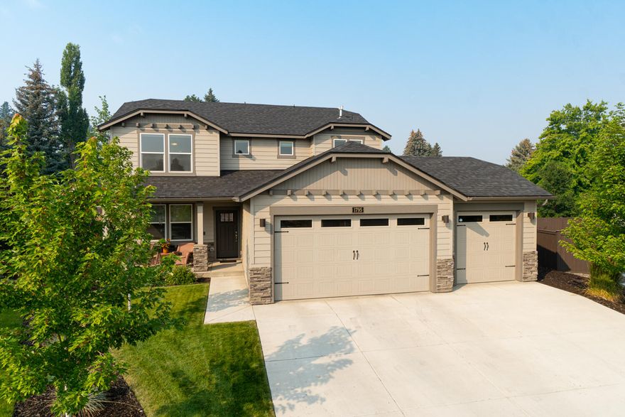 Immaculate home nestled in desirable NE Bend. Covered front porch leads to an open concept living w/engineered hardwood throughout the lower level, top down cellular blinds, quartz throughout & carpet upstairs. Main living area ftrs a cozy gas burning fp & convenient built-in work station. Kitchen has quartz counters, full height backsplash, large central island, stainless steel appliances, huge pantry, under cabinet lighting & soft close white cabinetry. Large eating area w/sliding doors that lead out back onto the patio. Primary bedroom boasts a spacious walk-in closet & bath ftring double vanities, enclosed toilet area, large soaking tub & tiled shower. Two other bedrooms share a full bath + a 4th bedroom off the entry w/French doors. Oversized laundry room w/built-ins. Expansive outdoor living space w/custom pergola complete w/shade screens & gas bbq hookup. 3 car garage, gas H2O water heater, A/C, Ring alarm system +more. Close to hospital, Pilot Butte & other East-Side amenities.