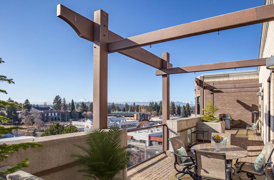 Welcome to luxury living in the heart of downtown Bend! This premier 5th floor Franklin Crossing condominium offers a unique opportunity to immerse yourself in the Central Oregon lifestyle with dining, shopping, recreation, and entertainment within an easy walk. Featuring massive mountain views and 1,933 square feet of open, well-appointed, bright and cheerful living space, this home offers 2-spacious bedrooms and 2-full baths. Revel from your perch above the treetops with a glass of wine as the sun sets over the Cascades and admire the 4th of July fireworks display with the best seats in the house from the expansive private patio. Thoughtful details include hardwoods, stainless steel appliances, cozy fireplace, plentiful storage, and laundry room. Controlled access building with 2-elevators, secure garage with 2-parking spaces featuring an electric vehicle charging station, ski locker, and 68 sq. ft. storage unit. Sold furnished and ready for you to start living your best Bend life!