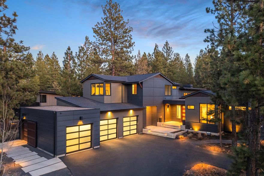 Experience the Ultimate Bend Lifestyle in Tetherow! Discover a hidden gem in the Glen neighborhood, where luxury meets adventure. Built by Timberline Construction, this exquisite home showcases exceptional craftsmanship, blending modern design with timeless elegance. Nestled amidst a serene, forested setting, this home offers unparalleled privacy and seamless year-round outdoor living, protected from the elements & just moments from the clubhouse, golf course, top-tier restaurants, & trails, w/ world-class golf & Mt. Bachelor right at your fingertips. Designed for versatility, this thoughtfully crafted home can easily convert to a 4-bedroom layout w/ two offices or flex space, all while boasting soaring ceilings, abundant natural light, & stunning luxury finishes. The oversized 3-car garage plus a dedicated golf cart bay, provides ample storage for all your Central Oregon adventures. Live, play, & unwind in one of Bend's most sought-after communities, this is living at its finest!