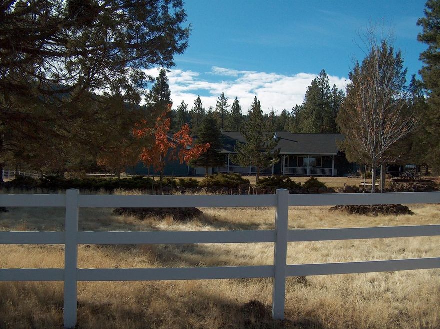 Jewel in Keno - hard to find a more picturesque setting and property than this beautifully treed 5 acres of property. Very appealing single level ranch home boasts over 2800 sq ft of living space with 2 beautiful certified wood burning stoves and excellent living areas, 4 bedrooms, 2 full baths and garden windows in the kitchen. Plenty of storage throughout and the master suite has a sitting area/office space with deep walk in closet. Covered porch out front with a large deck in the back. Besides the 2-car garage, there are 2 additional RV parking areas provided with hook-ups. Property is fenced. If you are looking for solitude and serenity, this is it, set against a picture-perfect mountain backdrop, stunning.