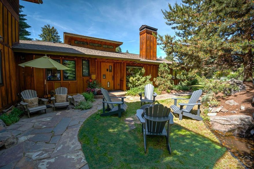 Stunning one-story Northwest Contemporary home on a large lot, with lush landscaping making it feel like a secluded oasis near Downtown Bend and Drake Park. Features include 3 bedrooms, 2 baths on one level with an attached 2-story 1 bedroom/1 bath that can be used for guests. Light and bright with meticulous craftsmanship, custom finishes, and completely remodeled in 2011 with exposed wood beams from Bend's historic Mill A. Whole house water filtration system and whole home energy efficiency upgrades by Green Savers.