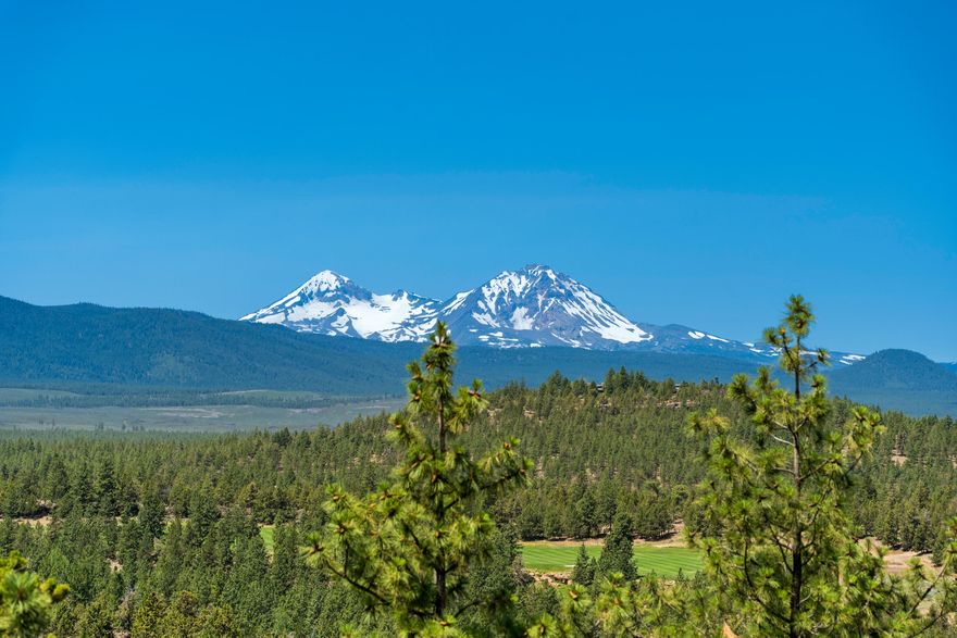 Discover luxury living in the exclusive gated community of North Rim in NW Bend. This exquisite home boasts 4 ensuites, & 4.5 baths, ensuring ultimate comfort & privacy. Nestled alongside the scenic neighborhood trail, it offers breathtaking Cascade Mtn. Views on a 1.0 acre homesite! The grand great room, w/ vaulted wood-beamed ceilings & a towering stone fireplace, forms the heart of the home. The gourmet kitchen features luxury level appliances & timeless custom cabinetry. Special features include a sophisticated wine cellar/tasting room & upstairs guest wing is complete w/ a kitchenette. Private courtyards & terraced paver decks provide intimate outdoor havens, seamlessly blending in/outdoor living. The primary bedroom wing features a flexible office space, & the spacious 3-car garage offers ample storage. Experience luxury and refined elegance in this meticulously crafted architectural gem.