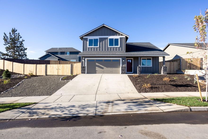 Just completed! Welcome to Korbin Meadows, a new community in desirable neighborhood of SW Redmond touting Cascade mtn views. Lot 4 is an oversized corner lot featuring the Willow floorplan w/ NW Craftsman design. Three bdrms + bonus room + den, 2 1/2 baths, utility/laundry & 2 car garage make up this 2,028 sf 2 level home. Primary bdrm on the main touts a walk-in closet, enclosed toilet & double vanity. Great mountain views from upstairs bonus room. Entertain in your kitchen w/ SS appliances, corner pantry, full height tiled backsplash, extensive slab quartz countertops, large island opening to great room w/ decorative gas burning fireplace. Durable laminate plank flooring thru-out & carpeted bdrms. Oversized backyard & side yard w/ fence & landscaping w/ sprinklers, RV/boat parking & entrance gate. Upgraded finishes & A/C included!  *Floorplan rendering subject to change.