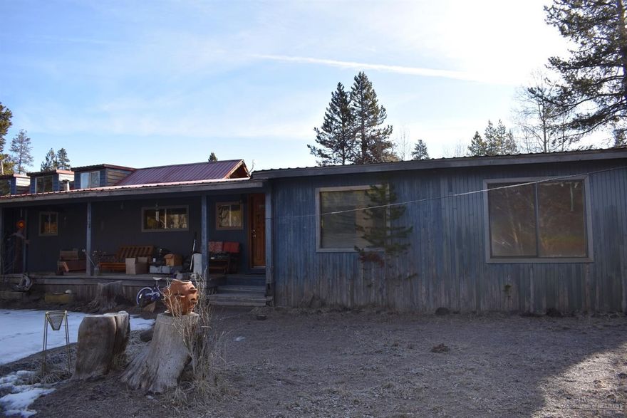 Investor alert! Who wants a nice 5 acre parcel with sweat equity opportunity. This one needs tons of TLC or a bulldozer. Priced for quick sale so call your favorite realtor today to check it out. The land features nice mature trees and some small outbuildings.