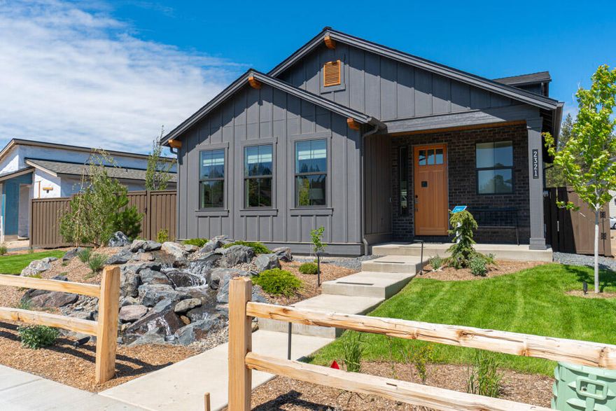 This is the MODEL HOME, Everett plan built in Treeline (Lot 21). This beautiful home, has the primary bedroom on main level. The gourmet kitchen is a chef's dream come true. It features stainless steel appliances (including W/D and fridge), custom cabinetry, a generous center island with a breakfast bar, and exquisite quartz countertops. Whether you're preparing a simple breakfast or hosting a culinary masterpiece, this kitchen will inspire your inner chef. Upstairs greats you with a spacious loft, separate office area and secondary bedrooms . This home is on a sizable lot and has MANY upgrades (some not even offered to other builds) including water feature and outdoor fireplace. Nestled in northwest Bend, this property offers the best of both worlds - a serene retreat in nature while being conveniently located near the Northwest Crossing amenities. Enjoy the nearby hiking and biking trails, golf courses, and recreational activities that make Bend a sought-after destination.