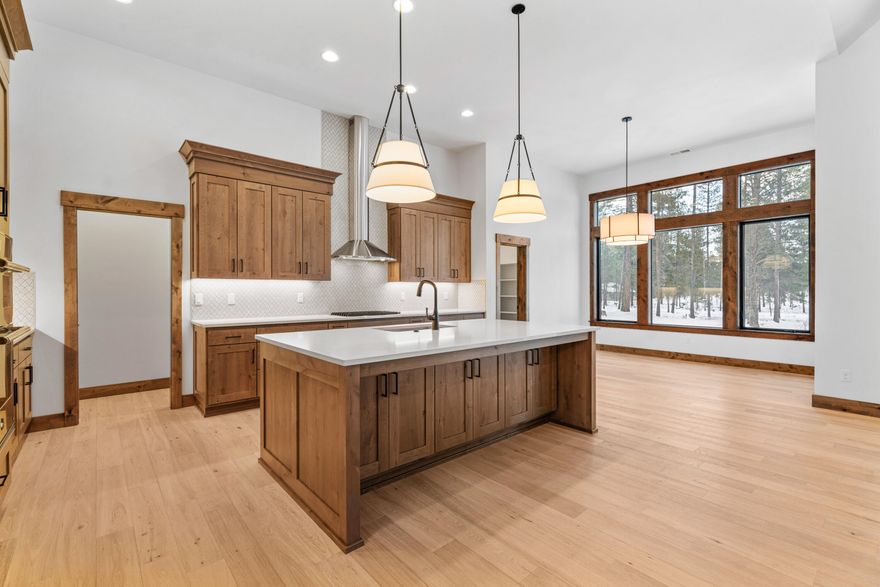 This stunning new construction home built by Stone Bridge Homes NW is set to impress with a spacious floorplan and luxurious finishes. The 3,857 SF home offers a thoughtful design for a second home or your primary residence located in the pristine Preservation neighborhood of Caldera Springs. The kitchen features custom stained knotty-alder cabinetry, a large quartz island and Jenn-Air appliances. Enjoy a luxurious primary suite, two additional en-suites and an office/den on the main level. Upstairs features 2 bedrooms and a full bath.  Additional features include insulated 3-car garage w/electric car charging outlets, pre-wired for hot tub, stamped concrete patios and cultured stone accents. Caldera Springs amenities include miles of trails alongside lakes & streams, 9-hole golf course, Quarry pool, Forest House pool & fitness center, complimentary use of bikes & paddleboards and much more.