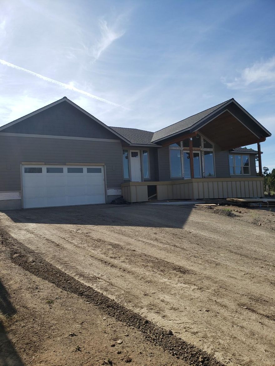 Gorgeous new construction on the Ridge in Eagle Crest. Fall in love with forever views of Smith Rocks and mountains to the east from the deck, great room and master bedroom. Beautiful kitchen with island, and stainless steel appliances. Great room floor plan with gas fireplace. Master bedroom/bath on opposite side of home from guest bedrooms/bath. Master bathroom has soaking tub and separate shower. Laundry sink in the utility room. Oversized 2 car garage, A/C, landscaping with timer controlled sprinkler system, this new home is ready for you. Grab it today!
