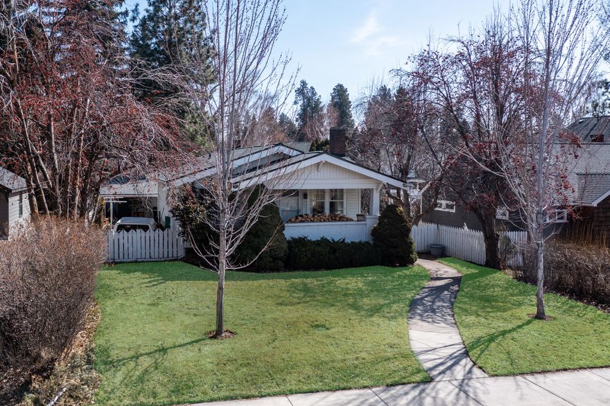 Built in 1921, this true Craftsman is located in the heart of Bend and is steeped in local history, just one block from the foot bridge at Pageant Park. The home has been owned by the current family for 3 generations. Original features include built-ins, some original hardware from a bygone era. Home has had some updating and additions over time. New Roof, Rear access, single car Garage/Carport area. Asphalt Driveway. Walk to Drake park, enjoy Munch 'n Music or all of the nearby restaurants and pubs in the area. 3 Bedroom, 3 Baths home. Deck off the side of the house for entertaining. 2 Bedrooms, living room, family room and 2 baths upstairs, 1 bedroom, utility room, bonus room and mud room, as well as a fruit room downstairs.