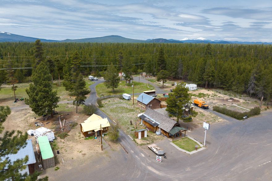 Tons of potential in this 5-acre RV park with room to expand to up to 40+ sites with the right septic system. Current Infrastructure includes seven septic systems (5 updated in 2017), two high-volume wells, and separate electric meters at each site. Property features include multiple outbuildings, an old 5-bay shop with 220 power, an office with a bathroom, a former general store, and a few income-producing rental cottages. Zoned CT (Commercial Transportation) has a variety of approved uses. A picturesque creek runs along the back border - an ideal investment opportunity with endless possibilities!

Contact your agent for more details.