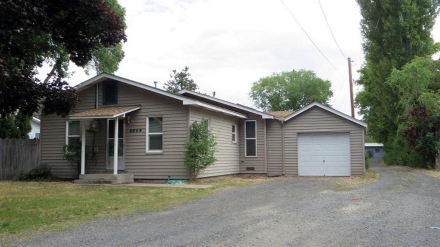 Two homes for the price of one! This is great for an extended family situation, or live in one and rent the other to help make the payment. The front home is site-built with 1,440 sq ft and 2 bedrooms, 2 baths. It's in great condition with a newer composition roof, vinyl siding and a single car garage. The home in back is an older manufactured home that has been remodeled and is in good condition. It has 2 bedrooms, 1 1/2 baths with a metal roof with vinyl siding. There is a detached double car garage with a large shop room. Both homes are heated with gas F/A furnaces. The lot is nearly 1/2 acre.