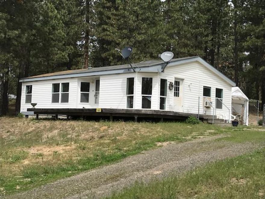 Nice clean 2002 manufactured home that sits on 4.24 acres. 3bed/2bath, 1061 sq ft. Nicely treed, large cleared area for additional buildings waiting to be built. Property has a 10 1/2 X 20 1/2 Metal Carport, 6 1/2 X 7 1/2 Pump Shed, 7' X 7' Rubbermaid Tool Shed. Owners added the following - 12'X26' reinforced car Canopy, 8'X12' Tuff Shop. Could be a great horse property.