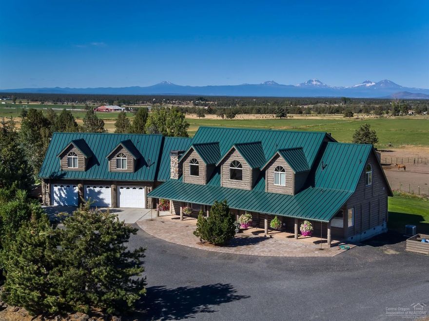 Stoneybrook Ranch is 79 acres in Powell Butte, OR. Custom home is 5066 sf 4 bedroom, 3.5 bathroom, great room with fireplace, master on the main, chefs kitchen, pantry, bar, dining room, sunroom, guest suite, office, covered porch and attached 3 car garage. Property has 60+/- acres of water rights for hay and grazing livestock. Barn has 8 stalls with runs, tackroom, with attached hay barn/shop. Detached 3 bay storage shop/garage. Private setting with beautiful landscaping and Cascade Mountain Views.