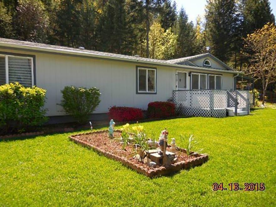 Terrific views from this well maintained 1993 Golden West, top of the line, double wide manufactured home. Features include: 1456 sf, 2 bedrooms plus den, 2 full baths with attached 1 car carport & RV carport with paved driveway on 3.15 hillside acres. Spacious master bedroom, dual sinks in master bath. Walk in shower with 2 seats. Vinyl windows, vaulted ceiling in LR, skylight, cozy fireplace, round window in arched ceiling, breakfast bar. Appliances included in sale: R/O, dishwasher & ceiling fan. 2 decks part covered, several storage sheds. Railroad tie retaining wall behind RV port. GPID access. Roof new 4 yrs ago.