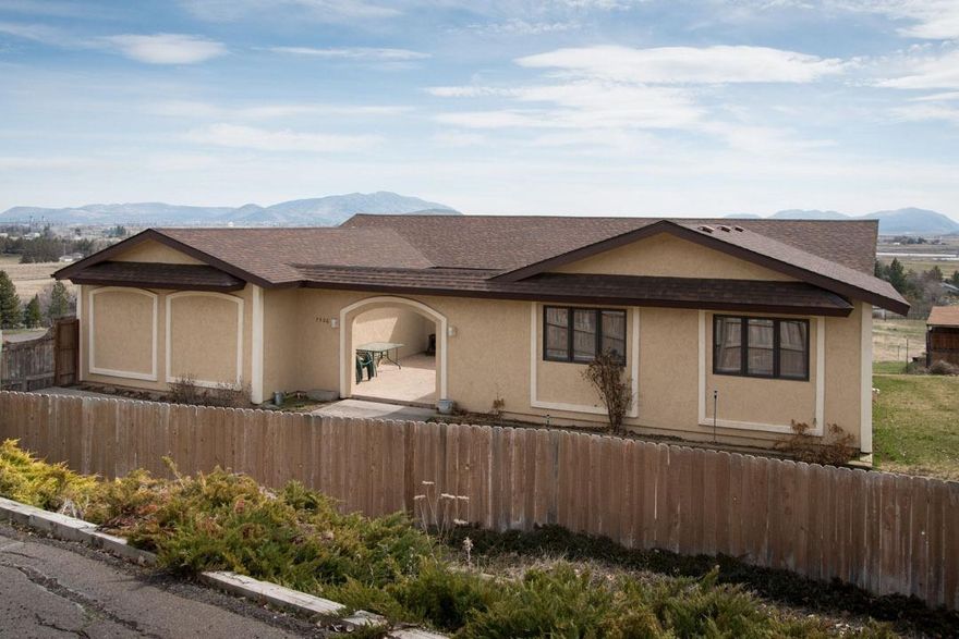 Acreage close to town. This lovely home welcomes you with expansive views and a relaxing courtyard. Most of the living is on the main level with a large kitchen, formal dining, den/office, with an outside deck, living room and all bedrooms and baths. One of the bedrooms easily lends itself to turning into a fourth bedroom with its own door, closet and window. Downstairs is a 1,400 square foot finished basement, perfectly set up for an exercise room plus a separate space for gatherings, pool table and more! Outside you will find open space with views, several fenced areas and pasture, and a 2-stall horse barn with a breezeway. So many possibilities with this property! **Extras** Within the last few years the home has had new carpet, new Lennox high-efficiency gas furnace, air conditioner, well pump and an 81-gallon tank, roof, gutters and exterior paint.