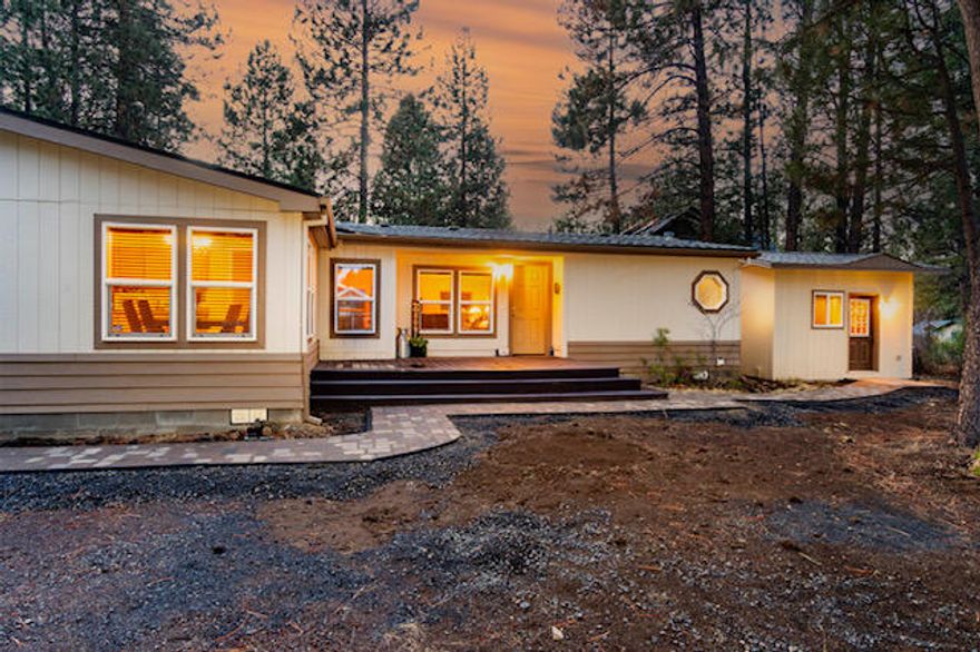 Nestled in the Pines of Deschutes River Woods on .90 Acre Lot. Home features 1869 sq. ft. of living space w/ 3 bdrms 2 baths & a separate 144 sq. ft. private building, currently being used as a home office. Lrg living rm is spacious w/ vaulted ceiling & plenty of rm for entertaining. Off the living room are the two lrg bdrms one w/ access to the backyard. New carpet & flooring throughout the house, a newly remodeled master bath w/ a beautiful new tiled walk-in shower, dual sinks.  Newly remodeled laundry room w/ plenty of storage & utility sink. Kitchen is large & open w/ plenty of storage & counter space. Separate from the home is a 24' x 26' two-car detached garage w/ an insulated built-in storage room. The lrg wood deck connects the house to the garage and has plenty of rm for outdoor furniture & hot tub. Property offers a treed front yard that would be perfect for outdoor living or to build a shop. Property is zoned for horses. Call to see what else this wonderful home offers!