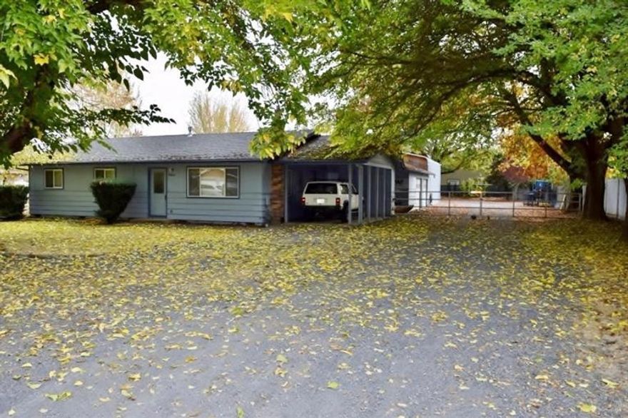 This 3 bedroom 1 bath, 1092 sq. ft. home on acre is situated in one of the most desired locations Central Point has to offer. Surrounded by seasoned shade trees, the home features an interior renovation in 2004! The property uses a well and is able to be connected to city water also. 28x40 2 car detached garage, breezeway, 20x40 metal building shop 14' rollup door, garden shed, water feature, fully landscaped, and a large graveled area for vehicle, trailer, equipment, or recreational storage. Don't miss this opportunity to tour this turnkey, sensational property! Buyer to do diligence on school zones.