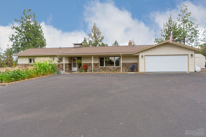 Updated ranch style home on the edge of Eagle Crest on 2 acres. Updated finishes include solid wood floors, professional grade appliances, dbl oven and granite counters. Open floor plan with oversized master w/soaker tub and walk-in closet. 3rd room could be an office or additional bedroom. Plenty of room for your toys with the 20X24 covered RV area, several outbuildings, paved driveway and dbl attached garage. MUST SEE!