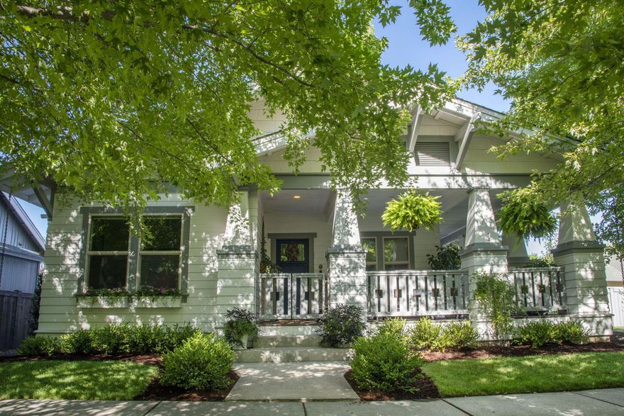 Charming, one-of-a-kind single-level Craftsman in desirable Canyon Rim Village with nearly $100K in upgrades! Enjoy coffee or a good book on the large, covered wrap-around porch. Cozy living room with a gas fireplace opens to a spacious kitchen and dining area with a large island—ideal for entertaining. Thoughtful layout with the primary suite privately situated at the back of the home, featuring double vanity, walk-in shower, and walk-in closet. Solid wood and glass French doors lead to a sunroom—perfect for a studio, indoor garden, workout, or quiet space—opening to a private patio and fenced side yard. Across the alley from a pocket park with open views. Separate utility room with skylight and an oversized 2-car garage with extra storage. Just blocks from the Dry Canyon Trail, West Canyon Rim Park, and the food carts at the Dry Canyon Club. This home is full of character, charm, and convenience!