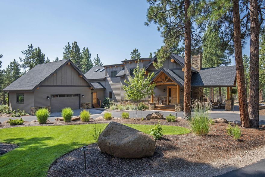 A custom built, luxury oasis in the pine trees. Revel in end of road privacy as you take in the views from this stunning, staggered beam constructed home with luxury finishes. Home thoughtfully features local artists' custom work: Zeitner glass light fixtures/ Skip Armstrong carvings. Dining/kitchen/primary wing all have 12 ft ceilings. Main level primary with spa like bath has access to deck, hot tub and views. Upstairs features 2 bedrooms, 1.5 baths, flex area (could be gym, studio, etc). Lounging loft area w/balcony, wet bar and more views! Covered outdoor entertainment area with fireplace, tv hook up, and extensive decking. Paved, circular drive. Custom, glass greenhouse w/raised planting beds. RV garage with power/water/dump. HOA includes access to trails, picnic area and Wychus Cr.