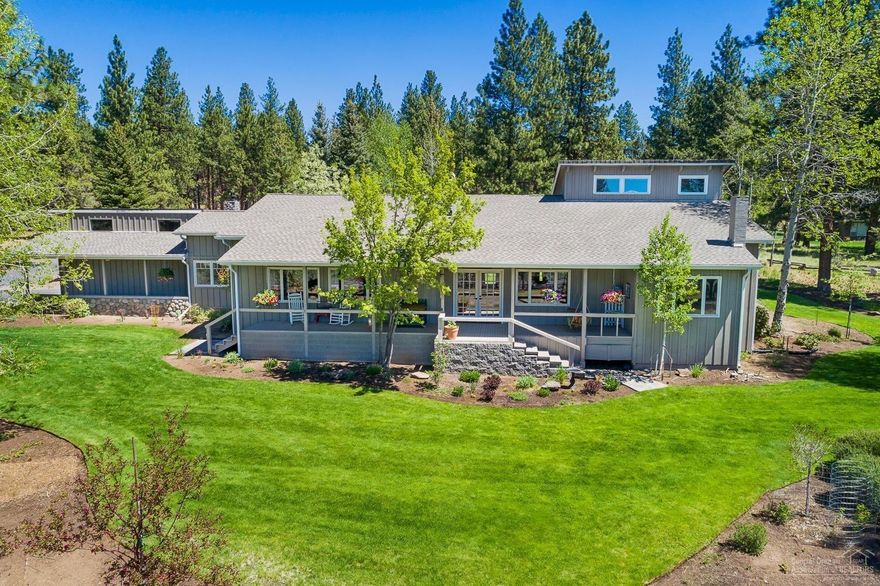 Incredible NW Lodge style home with a wow factor both inside and out.Stunning Cascade Mt views & Indian Ford Meadow Preserve.Quality you can see-the heart of the home is an incomparable open concept floor plan with cathedral ceilings, exposed beams, stunning wood floors & 2 floor-to-ceiling river rock fireplaces.All bedrooms are en-suite master bed/baths, w/2 masters on main, plus office, additional 4th bath & sunroom breakfast nook.Peaceful 2 acre lot & huge front porch to soak up your one of a kind views!